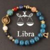 Zodiac energy bracelet for Libra with blue stone beads, gold ring charm, star charm