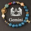 Zodiac energy bracelet for Gemini with blue stone beads, gold ring charm, star charm