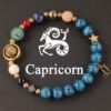 Beaded zodiac planet energy bracelet with blue stones, gold charms, Capricorn