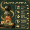 Ritual mist fragrance bottle with dark sphere cap and red label on an ornate board