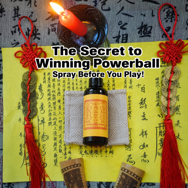 Fragrance mist spray bottle with yellow label, black cap, and red tassel charms
