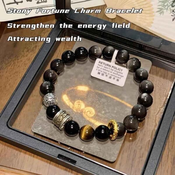 Dark bead protection bracelet with silver-toned bead accents and gold-toned clasp