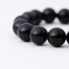 Round black gemstone beads on tourmaline beaded bracelet