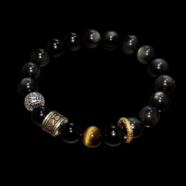 Black bead bracelet with silver-toned end charm and gold ring accent