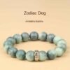 Green bodhi bead bracelet with carved round beads and central metal zodiac charm