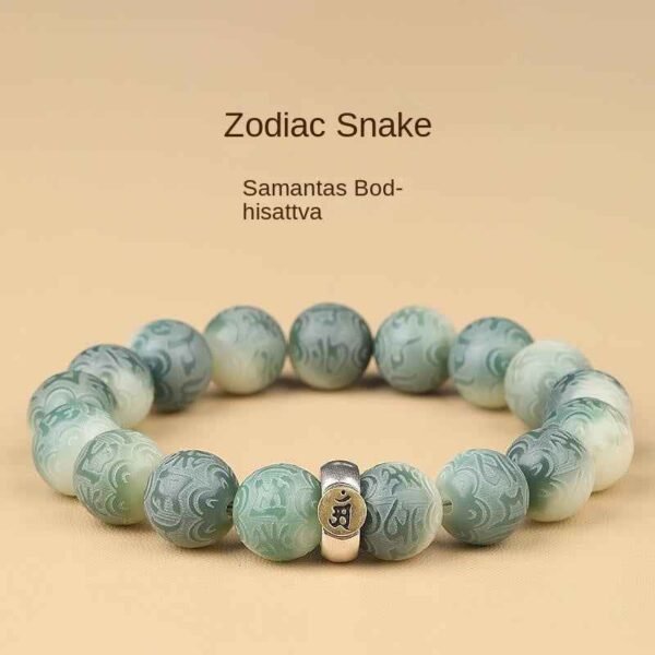 Green bodhi bead bracelet with carved bead pattern and central metal zodiac charm