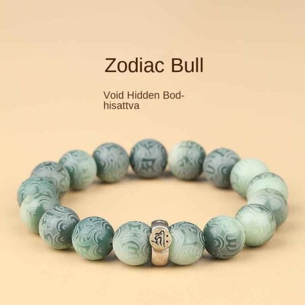 Green bodhi bracelet with round carved beads, silver-toned center charm detail