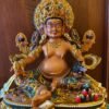 Handcrafted Yellow Dzambhal Brass Statue – Nepalese Style Tibetan Buddhist Deity with Painted Back Panel (9 inch)