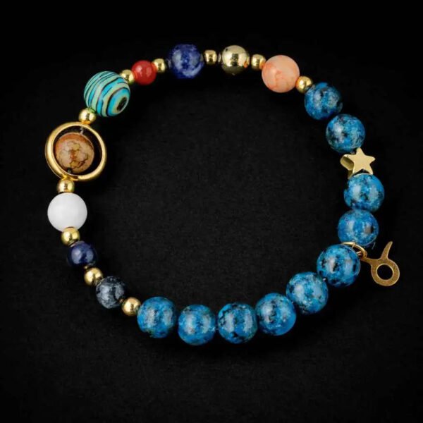 Zodiac energy bracelet for Pisces with blue beaded strand, gold charms, and oval planet beads